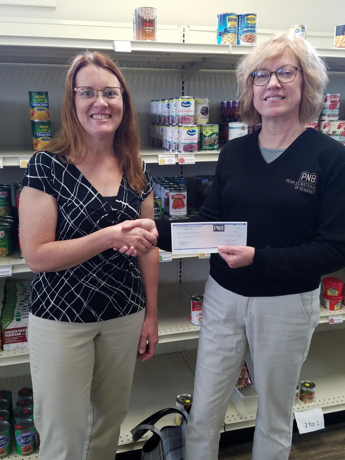 Lorrie Lord donates to Geneseo Food Pantry